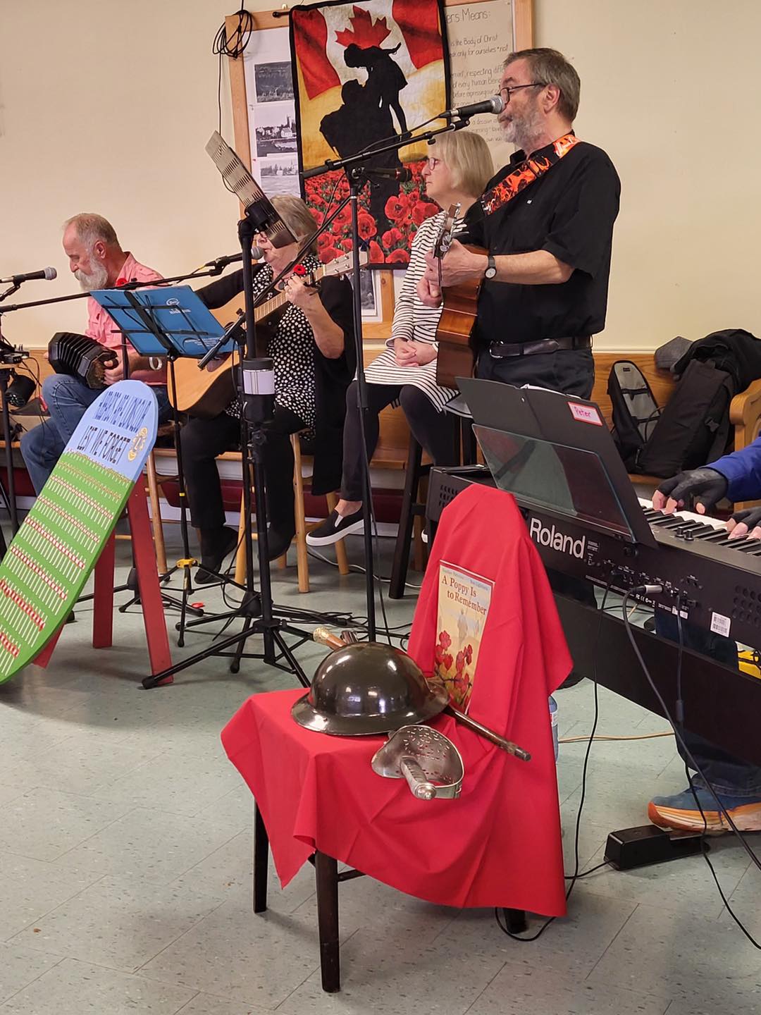 A Community Remembrance service was
    held at Two Coves Cafe on November 7, sponsored by
    The Outreach Mission Group, hosted by the Cafe and
    organized by Brenda Munro. Music was by Shenanigan,
    Peter Grant, Carol & Donnie Webb and Dave Anderson.
    Special guests were Rebeccah Stone's class from
    Shatford Memorial School